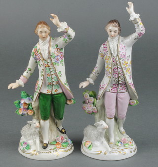 2 early 20th Century Sitzendorf figures of shepherds besides stumps with sheep at their feet, on rococo bases 7 1/2" 