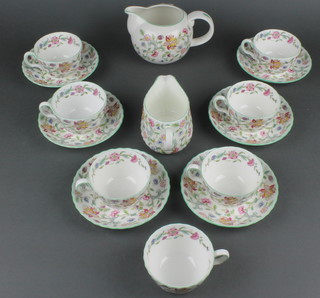 A 16 piece Minton Haddon Hall tea service comprising large jug, milk mug, 6 saucers and 7 cups 