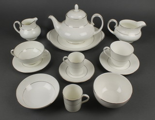 An 80 piece Royal Doulton Lacepoint patterned tea/dinner service comprising 12 dinner plates, 12 tea plates, 6 twin handled soup bowls and saucers, 13 tea plates, sauce boat, cream jug, sugar bowl, teapot, twin handled bread plate, 12 bowls, 18 saucers, 12 tea cups, 6 coffee cans