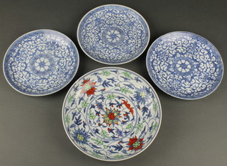 An early 20th Century Chinese shallow dish decorated with scrolling flowers, bearing a 6 character mark enclosed in a double ring to base 9", 3 Provincial blue and white dishes 7" 
