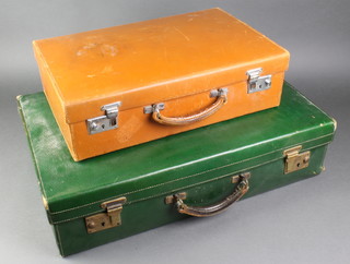 A 1930's/40's green leather suitcase with brass mounts 6"h x 24"w x 15"d together with a brown leather case by Finnigans 5"h x 18"w x 12"d 