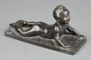 Hugo Elmqvist, a bronze figure of a reclining child, signed, 6 1/2" 
