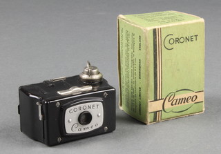 A Coronet black cameo miniature camera with original cardboard carton 