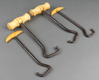2 pairs of 19th Century steel and bone handled boot hooks 
