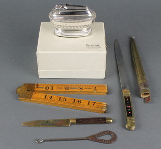 A Ronson Queen Anne silver plated table lighter in the form of a dagger with 6 1/2" straight blade, a 24" gauge, etc 