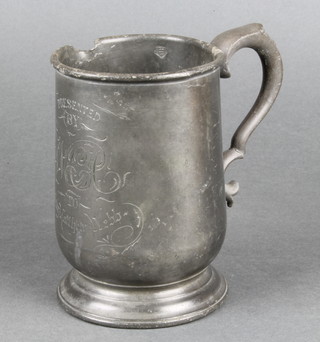 A Victorian pewter pint tankard presented by W L C to Captain Matthew Webb, the base marked East India Arms High Street Popular, dent to body and half an inch removed from top, NB Captain Webb was the first man to swim the English Channel 