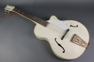 A 1950's Egmond Lucky 7 arched top guitar