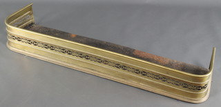 A 19th Century pierced brass fender 6"h x 45"w x 11 1/2"