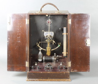 A 1930's Electrotherapy machine patent no. 422285, contained in a mahogany wedge shaped case 