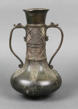 An 18th/19th Century Chinese twin handled bronze vase, raised on a circular foot 10", some dents 