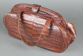 A lady's brown crocodile handbag 