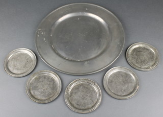 A circular Continental pewter plate marked Zinn 13" together with 5 Continental pewter coasters marked Etain 4 1/2" 
