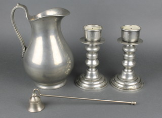 A baluster shaped Continental pewter jug, the base marked 95 % Fein Zinn 10" together with a pair of 17th Century style circular pewter candlesticks 8" and a candle snuffer 