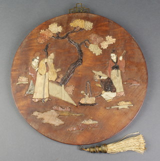 A circular Chinese plaque set hard stones decorated figures beneath a tree 12" (some sections missing) 