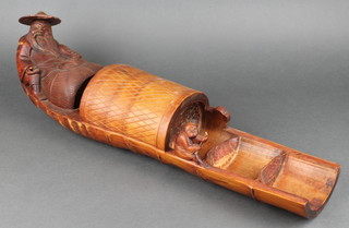 A Chinese carved bamboo model of a boat with seated fisherman 24" 