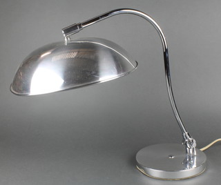 A polished chrome desk lamp 