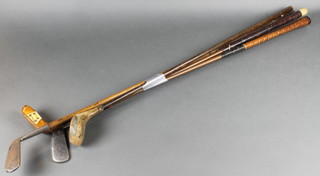 A Tsspareg hickory shafted no.2 special iron, a hickory shafted driver (cut down), an iron shafted driver, an iron shafted putter 