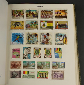 An album of mint and used World stamps including Greece, large collection of Guinea, Finland, Haiti, Honduras