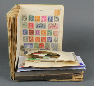 A schoolboy's Olympic stamp album and a Victory schoolboy's album of various stamps 