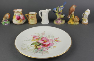 A circular Worcester plate decorated flowers, painted by E Ratcliffe 9", a waisted Worcester vase decorated roses 3", a Victorian blush ivory Worcester jug decorated chrysanthemums 2 1/2", a Worcester blanc de chine fern pattern jug 3 1/2", ditto candle snuffer in the form of a young girl 3", 3 Worcester figures of birds