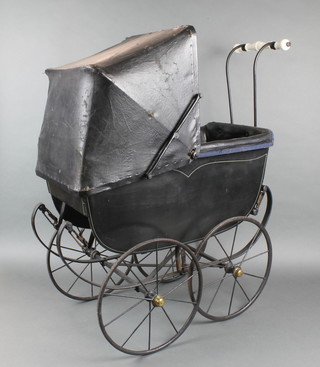 A child's Coachbuilt perambulator with solid iron spoked tyres 