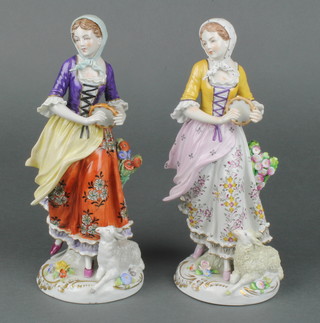 A pair of early 20th Century Sitzendorf figures of shepherdesses holding tambourines, on raised rococo bases 9" 