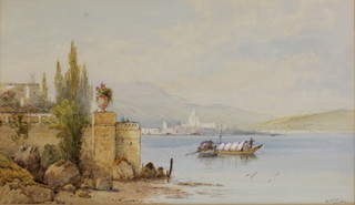 E St John, watercolours, a pair, southern European lakeside scenes with boats and buildings, signed, 11" x 18 1/2" 