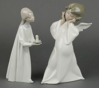 A Lladro figure of an Angel 9", a ditto of a girl holding a chamberstick 8" 