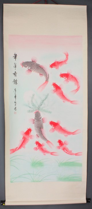 20th Century Chinese watercolour, a scroll painting depicting carp amongst weeds, signed 50" x 25" 