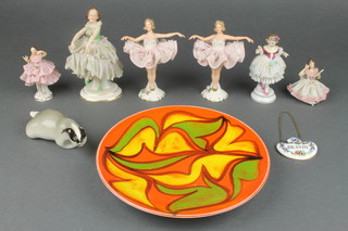A 1960's Poole Pottery shallow dish, the orange ground with freeform decoration 8", 6 Dresden style figures and a spirit label 