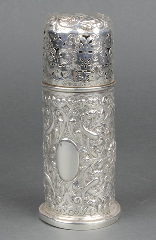 A Victorian silver bullet shaped caster with pierced and repousse decoration, London 1888, 6 1/2" 