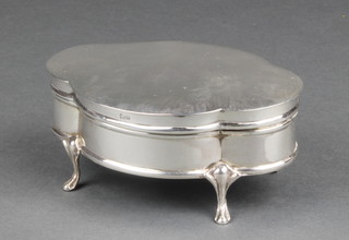 An Edwardian silver quatrefoil trinket box on scrolled feet, Birmingham 1907 4 1/2" 