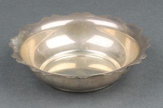 A circular silver nut dish with cut rim, Birmingham 1920, 46 grams