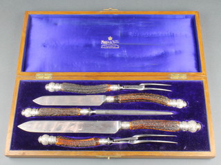 A Victorian silver mounted horn handled 5 piece carving set by Mappin & Webb in a fitted mahogany box 