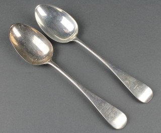 A Victorian silver Old English table spoon London 1879 and 1 other 140 grams
