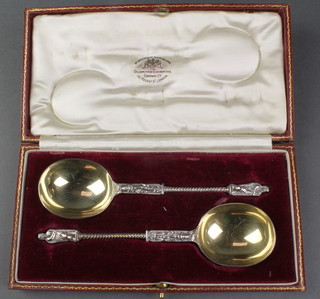 A pair of cased silver antique style apostle spoons with gilt bowls in a fitted case, London 1919, 90 grams