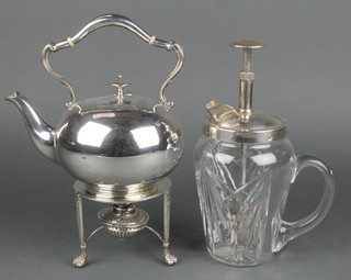 An Edwardian silver plated tea kettle on stand with burner and a plated mounted cocktail stirrer 