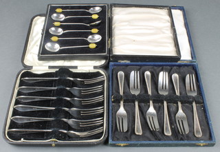 A set of 6 silver bean end coffee spoons, Birmingham 1924, 2 cased sets 