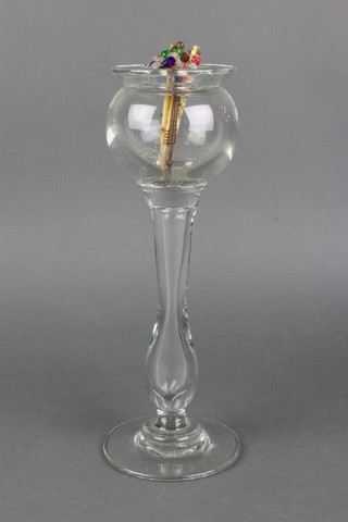 A 19th Century clear glass lacemakers lamp 11" together with turned ivory bobbins and a wooden bobbin 