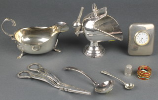 A silver plated sauce boat, ditto timepiece and minor items 