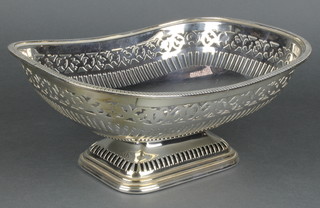 A silver plated pierced boat shaped bowl on waisted foot 