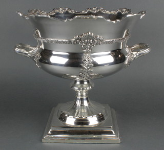A large silver plated 2 handled wine cooler of urn form with waisted stem and square base, having repousse decoration 18" 