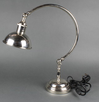 A silver plated mounted student's lamp on a circular base 17" 