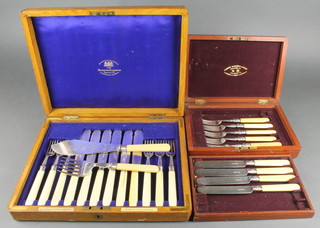 An Edwardian canteen comprising a set of fish pairs for 6 and servers, a silver plated cased set 