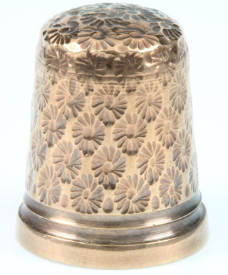 A 9ct gold thimble with floral decoration 4.5 grams 