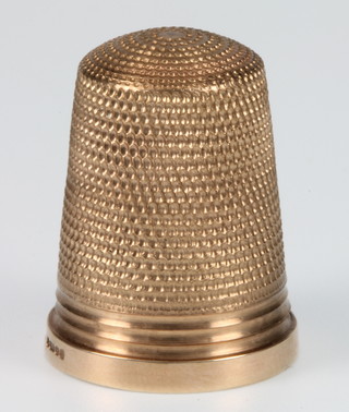 A 9ct gold thimble of plain form 5.4 grams