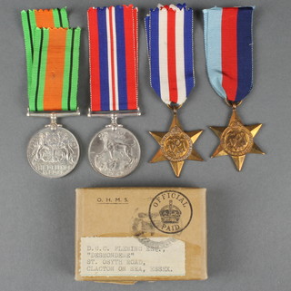 1939-45 France and Germany Stars, Defence and War medals to D G C Fleming in posting box 
