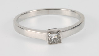 An 18ct white gold single stone princess cut diamond ring, size L 