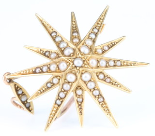 An Edwardian 15ct seed pearl set star set pendant brooch 