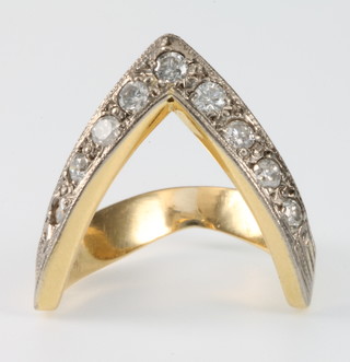 A 9ct gold 9 stone diamond wishbone dress ring, size N
